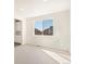 Inviting living room with large windows, neutral carpet and recessed lighting at 9089 Pitkin St, Commerce City, CO 80022
