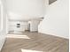 Open-concept living space with a modern kitchen and large windows at 9089 Pitkin St, Commerce City, CO 80022