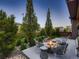 Cozy backyard featuring a modern fire pit and seating area surrounded by landscaping at 10968 Pastel Pt, Parker, CO 80134