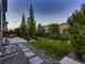 Landscaped backyard featuring a well-maintained lawn and a cozy fire pit area at 10968 Pastel Pt, Parker, CO 80134