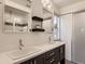 Double vanity bathroom with ample counter space, large mirrors, and stylish lighting at 10968 Pastel Pt, Parker, CO 80134