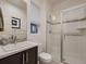 Modern bathroom with glass enclosed shower, and decorative mosaic tile at 10968 Pastel Pt, Parker, CO 80134