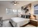 Calming bedroom with neutral colors, soft carpet, large mural and plenty of natural light at 10968 Pastel Pt, Parker, CO 80134