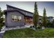 Beautiful home exterior with a covered patio and landscaped backyard at 10968 Pastel Pt, Parker, CO 80134