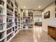 Spacious open living space with hardwood floors and built-in bookshelves at 10968 Pastel Pt, Parker, CO 80134
