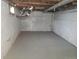 Unfinished basement with painted walls that is ready for storage or future renovation at 4990 Hooker St, Denver, CO 80221