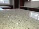 A close-up of a white granite kitchen countertop with brown and gray flecks of color at 4990 Hooker St, Denver, CO 80221