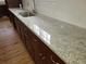 A kitchen counter with stainless steel sink, modern faucet, and a white subway tile backsplash at 4990 Hooker St, Denver, CO 80221