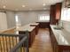 An open kitchen area features a large island, wood cabinets, and hardwood flooring at 4990 Hooker St, Denver, CO 80221