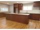 Spacious kitchen featuring a large island with granite countertops and ample storage at 4990 Hooker St, Denver, CO 80221
