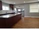Open kitchen featuring an island with granite countertops and modern lighting at 4990 Hooker St, Denver, CO 80221