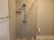 A beautifully tiled shower featuring modern fixtures, and ample space at 4990 Hooker St, Denver, CO 80221