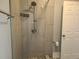 Recently remodeled shower features a modern shower head, shelving, and white tiled surround at 4990 Hooker St, Denver, CO 80221