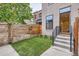 Backyard with a well-maintained lawn and privacy fence at 2846 Champa St, Denver, CO 80205
