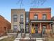 Beautiful brick home exterior with a covered porch and inviting entryway at 2846 Champa St, Denver, CO 80205