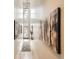 Bright hallway with modern art, hardwood floors, and high ceilings at 2846 Champa St, Denver, CO 80205