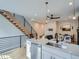 Open kitchen design with island seating, connecting to the living area and staircase at 2846 Champa St, Denver, CO 80205