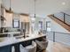Modern kitchen with stainless steel appliances, island seating, and open layout at 2846 Champa St, Denver, CO 80205
