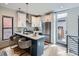 Stylish kitchen with white cabinets, stainless steel appliances, and island seating at 2846 Champa St, Denver, CO 80205