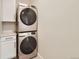 Bright laundry room with stainless steel washer and dryer at 2846 Champa St, Denver, CO 80205