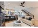 Open-concept living room with modern kitchen, staircase, and hardwood floors at 2846 Champa St, Denver, CO 80205