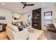 Bright living room features a stone fireplace, modern ceiling fan, and hardwood floors at 2846 Champa St, Denver, CO 80205