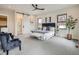 Bright main bedroom with a decorative ceiling fan, bench seating, and modern decor at 2846 Champa St, Denver, CO 80205