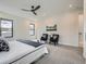 Bright main bedroom with accent chairs, ceiling fan, and modern decor at 2846 Champa St, Denver, CO 80205