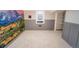 Finished basement boasts plush carpeting, wainscoting, mountain mural and updated lighting at 2548 S Zurich Ct, Denver, CO 80219