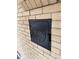 Charming brick exterior shows dog treat door with 'Dog Treats' inscription for pet lovers at 2548 S Zurich Ct, Denver, CO 80219