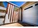 Unique custom gate and garage door with natural light and brick exterior at 2548 S Zurich Ct, Denver, CO 80219