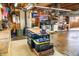 Large garage with well-lit workshop and functional storage solutions for tools and equipment at 2548 S Zurich Ct, Denver, CO 80219