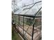 Well-maintained greenhouse with ample sunlight and growing space, ideal for gardening enthusiasts and plant cultivation at 2548 S Zurich Ct, Denver, CO 80219