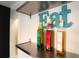 Kitchen shelving with decorative bottles and an 'Eat' sign at 2548 S Zurich Ct, Denver, CO 80219
