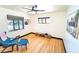 Bright living room features hardwood floors, neutral paint, updated lighting and minimalist decor at 2548 S Zurich Ct, Denver, CO 80219