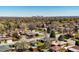 Scenic neighborhood view with lush greenery and the city skyline in the distance at 2548 S Zurich Ct, Denver, CO 80219