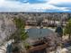 An aerial view shows the roof of the property and the surrounding lush neighborhood at 4212 E Orchard Pl, Centennial, CO 80121