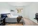 Comfortable bedroom with a large window offering plenty of natural light at 4212 E Orchard Pl, Centennial, CO 80121