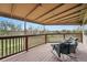 Relaxing covered deck with comfortable seating and a serene outdoor view, perfect for enjoying the scenery at 4212 E Orchard Pl, Centennial, CO 80121