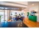 Open layout of the dining area and living room, with hardwood floors and modern decor at 4212 E Orchard Pl, Centennial, CO 80121