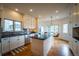 Updated kitchen featuring stainless steel appliances and a large island at 4212 E Orchard Pl, Centennial, CO 80121