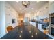 Well-lit kitchen with a large island and modern appliances at 4212 E Orchard Pl, Centennial, CO 80121
