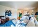 Open concept living room flowing into the dining area with hardwood floors at 4212 E Orchard Pl, Centennial, CO 80121