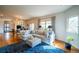 Inviting living room with hardwood floors and a large sectional at 4212 E Orchard Pl, Centennial, CO 80121