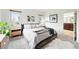 Inviting main bedroom features neutral tones, soft carpet, and ample natural light, offering a tranquil retreat at 4212 E Orchard Pl, Centennial, CO 80121