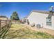 Backyard with lush lawn and patio, ideal for relaxation at 200 Vista Blvd, Brighton, CO 80603