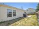 Backyard showcasing a well-maintained lawn, patio, and exterior of home at 200 Vista Blvd, Brighton, CO 80603