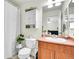 Clean bathroom featuring a vanity, toilet, and shower with neutral colors and good light at 200 Vista Blvd, Brighton, CO 80603
