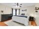 Comfortable bedroom featuring neutral decor, hardwood floors, and natural light from the window at 200 Vista Blvd, Brighton, CO 80603