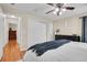 Spacious bedroom with closet, neutral walls, ceiling fan, and access to the other rooms at 200 Vista Blvd, Brighton, CO 80603